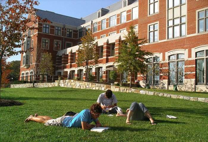 Students laying on grass lawn at Georgetown University