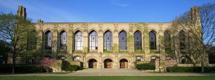 An ivy-covered building with ovular windows is featured from Northwestern University.