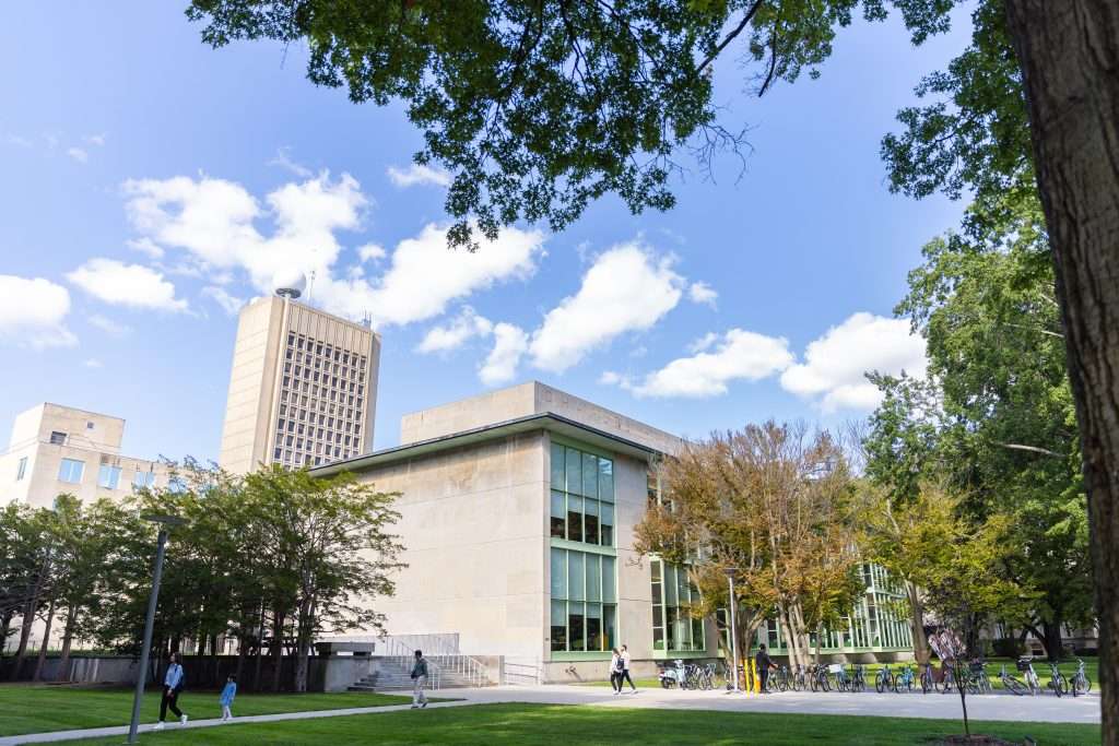Students walk across MIT's campus.