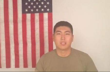 This is a portrait of William Wang in front of an American flag.